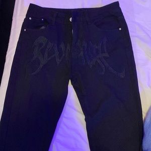 Some cool black pants with the wording revenge with the cool design
